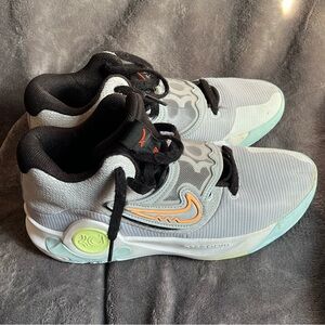 Nike Gray and Black Athletic Shoes with Orange Accents